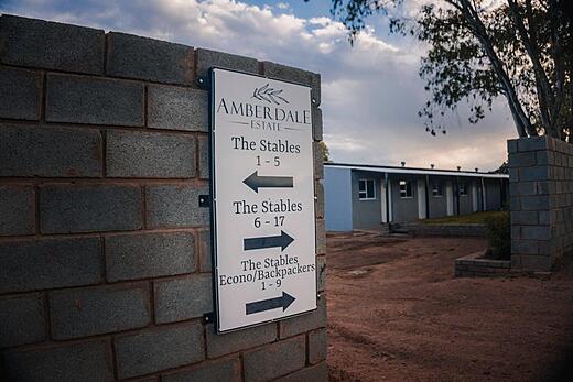 Amberdale Estate sign directing guests to The Stables and the economy rooms